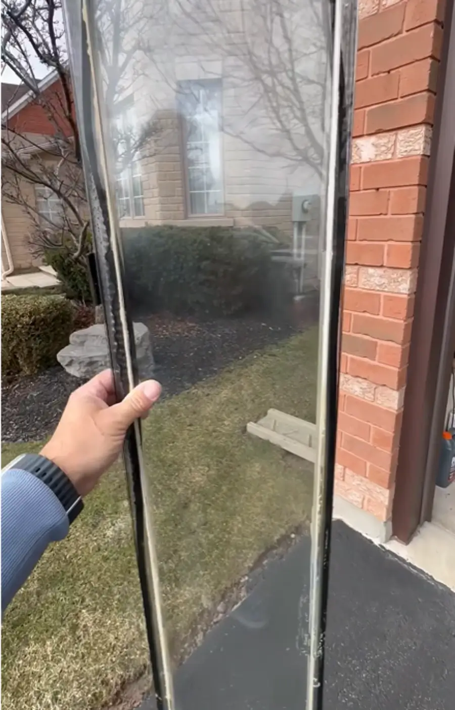 Foggy San Clemente window with condensation trapped between the double-glazed panes