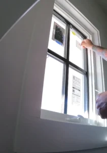 removing sticker post construction window cleaning San Clemente